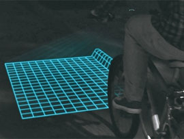 Велосипедний світлодіодний ліхтар проектує на дорогу сітку